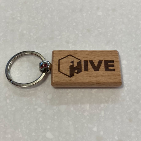 Wooden keychain with laser engraved HIVE logo 